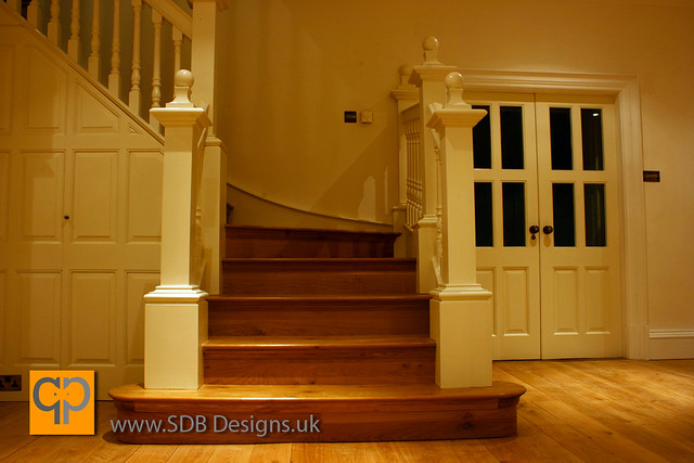 A close up of bullnose step and white staircase by SDB Designs designed and made by Sean Broadbent