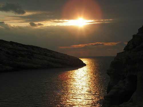 greece crete matala evening sunset bay coast worldtrekker