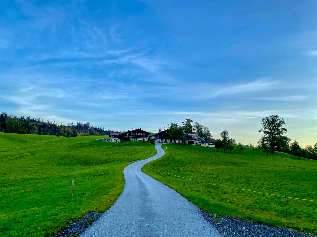 Winding road to a farmstead near lake Hechtsee in Tyrol, Austria
