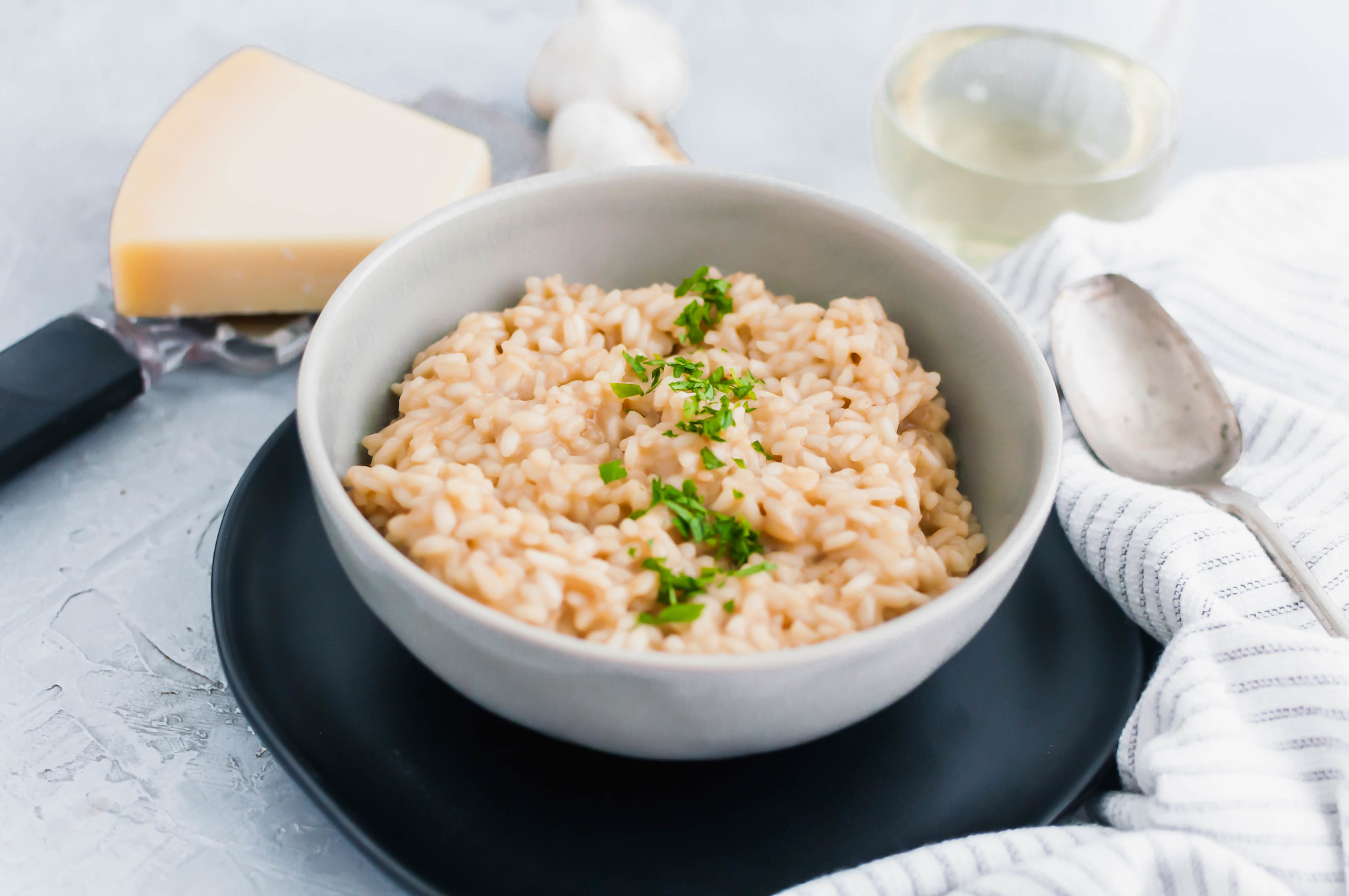 Date night in just got fancy with this Roasted Garlic Risotto. Sweet, nutty roasted garlic & classic risotto combine to make a delicious dish.