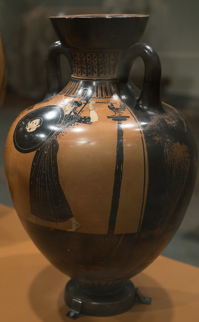 Athenian Black Figure panathenaic amphora representing a discus-thrower and trainer or judge: reverse with Athena