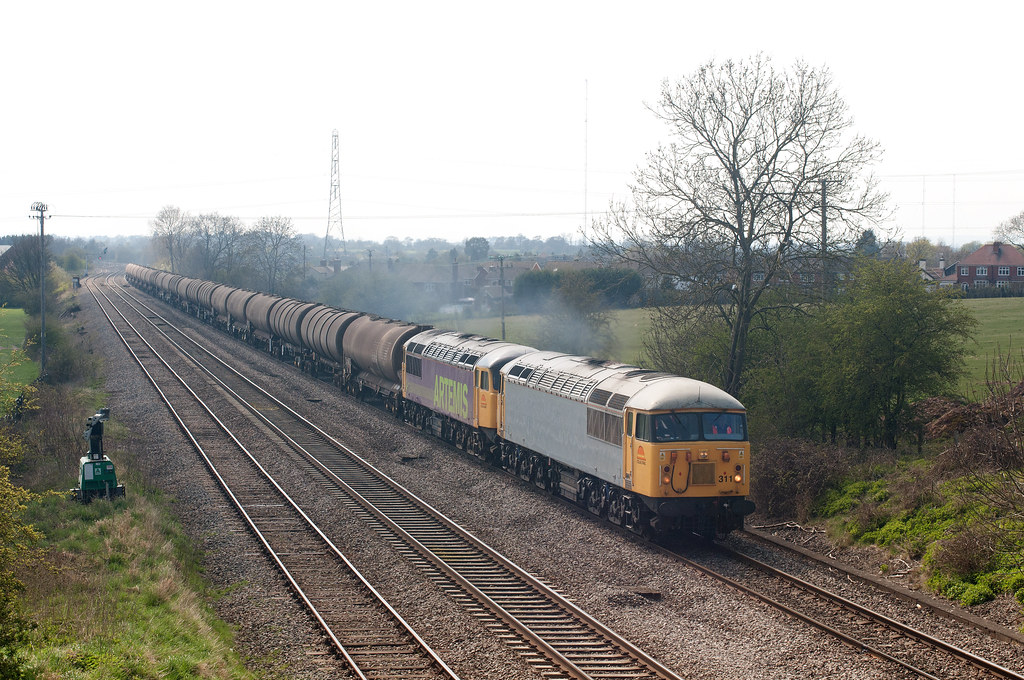 Hanson Traction's Class 56's No's. 56311 and 56312 haul 6Z56, the 13.10 Long Marston depot to Bescot Yard empty TEA oil tanks away from Stoke Works Junction.
