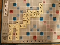 A Scrabble game in German, French, and English