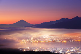 Morning glow ---Mt. Fuji and foggy city---