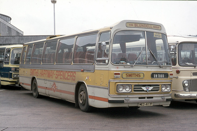 Smith . Wigan , Lancashire . 9 MED407P . Bretonside Bus Station , Plymouth , Devon . Late September-1976 .