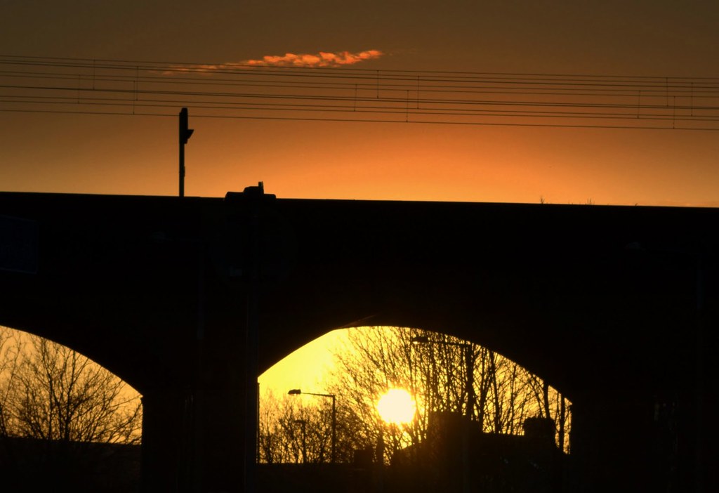 Sunset under the railway bridge at Preston