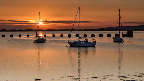 langstoneharbour mooredboats sunset silhouettes