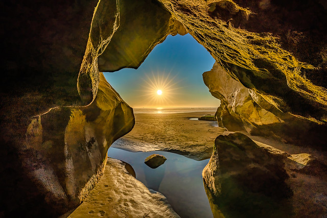 Sea Cave Sunset - in Explore