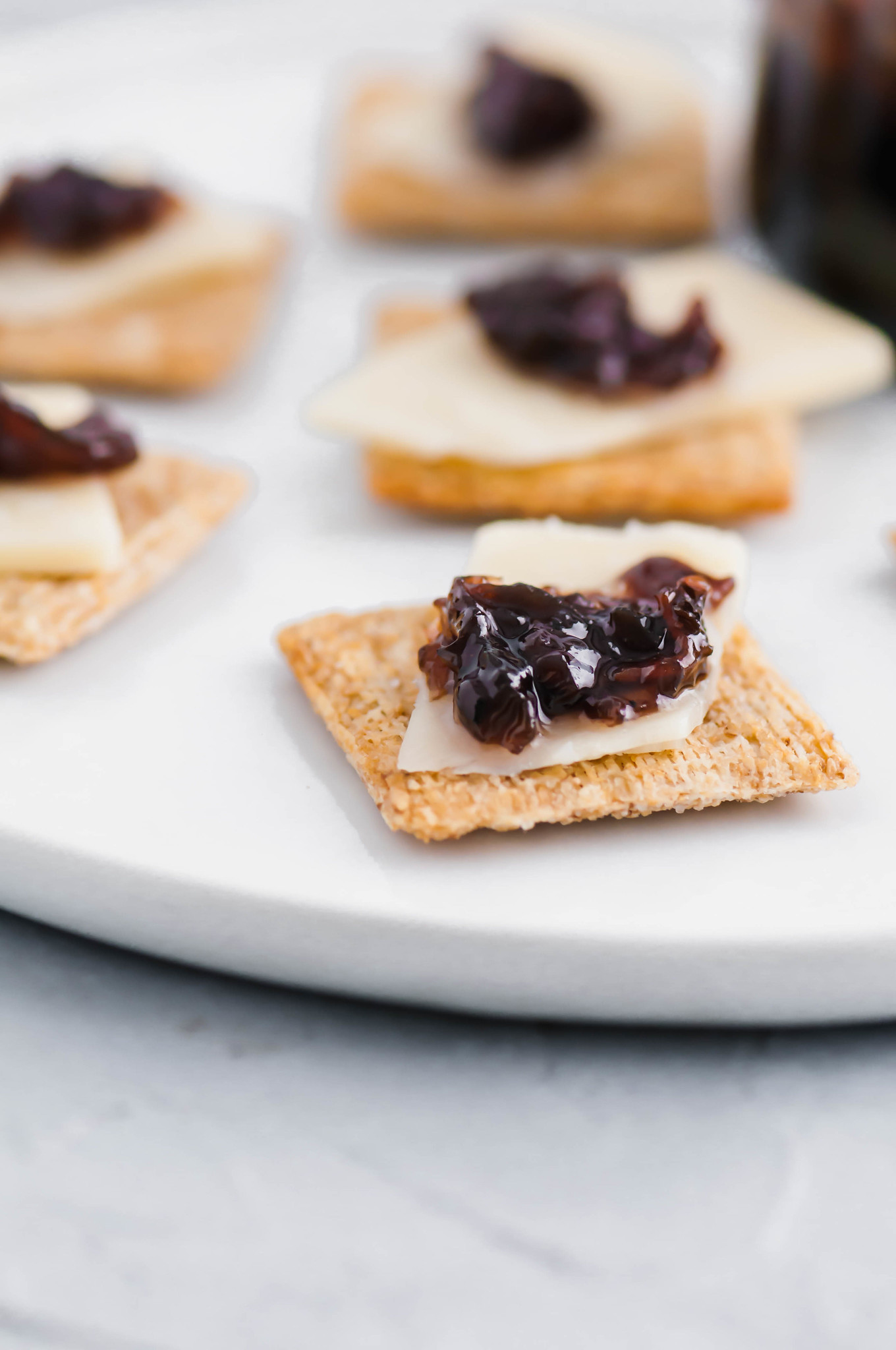 Bacon Onion Jam is a delicious, sweet and savory condiment that is going to blow your mind. Smoky bacon, red onions, sugar and vinegar are cooked down to create a thick, caramelized jam that is delicious on crackers, sandwiches, brie and more. 