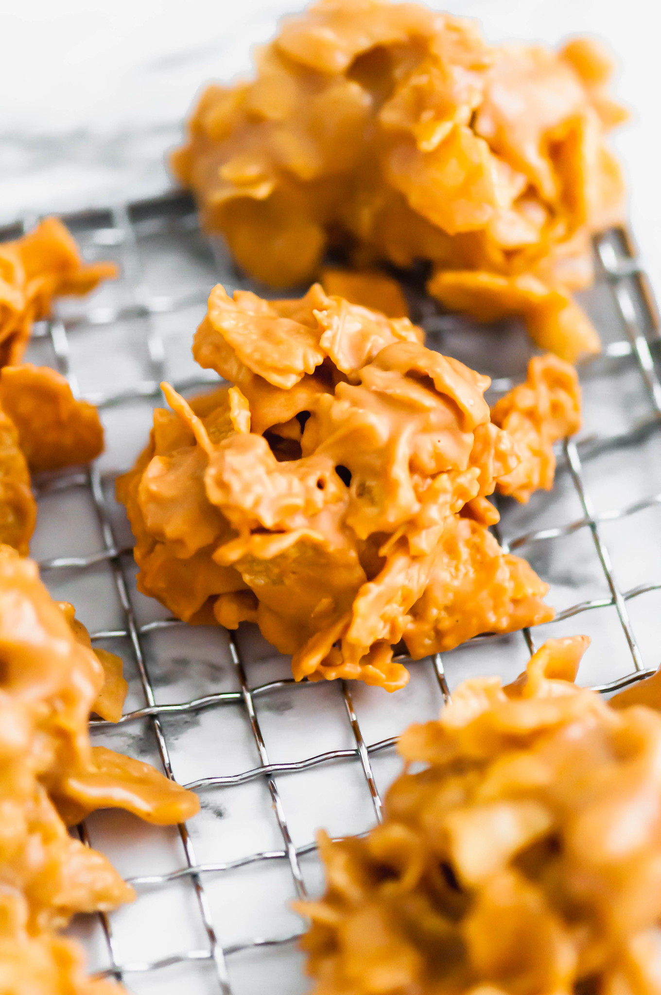 These delicious, simple little corn flake cookies can be made using peanut butter or butterscotch chips. A wonderful addition to your Christmas cookie lineup.