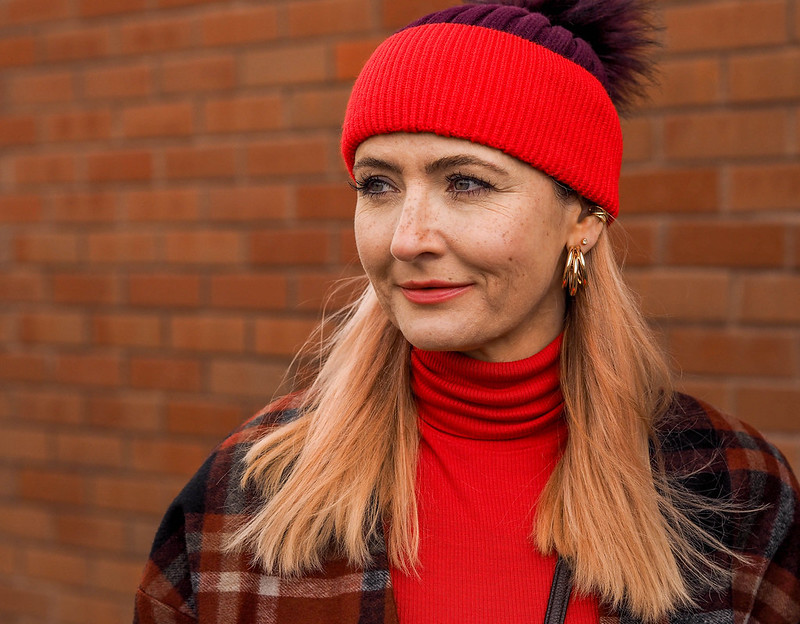 Styling a Timeless Tartan Jacket (an Autumn/Winter outfit of loose, red tartan jacket, plum peg leg trousers, tomato red roll neck, two-tone plum/red bobble hat & burgundy high-top trainers with faux-fur trim | Not Dressed As Lamb, Over 40 Fashion