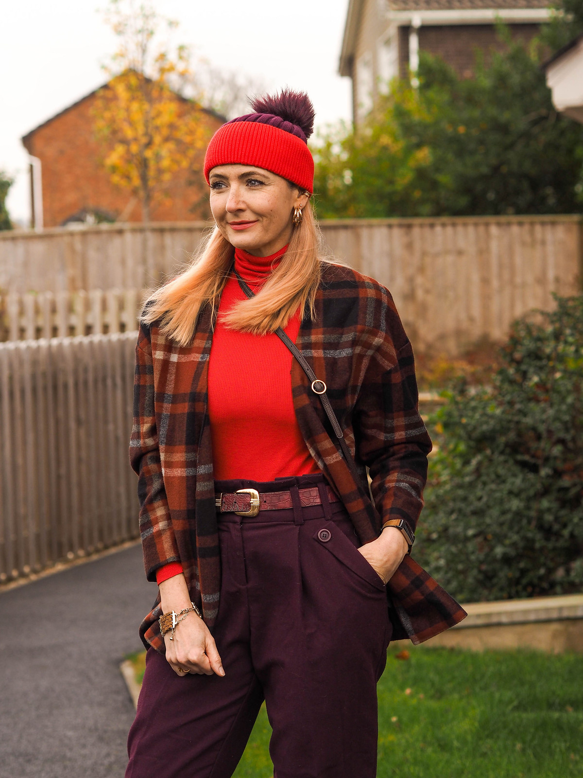 Styling a Timeless Tartan Jacket (an Autumn/Winter outfit of loose, red tartan jacket, plum peg leg trousers, tomato red roll neck, two-tone plum/red bobble hat & burgundy high-top trainers with faux-fur trim | Not Dressed As Lamb, Over 40 Fashion
