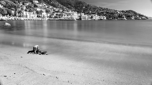 rapallo metropolitancitygenoa italy kiltro liguria italia longexposure beach sand water sea ocean shore coast bw blackandwhite town city landscape