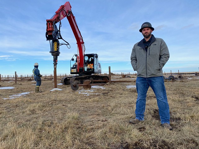 Bryce Bernhard with screw pile excavator