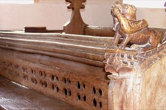 15th Century bench and a dog with a duck