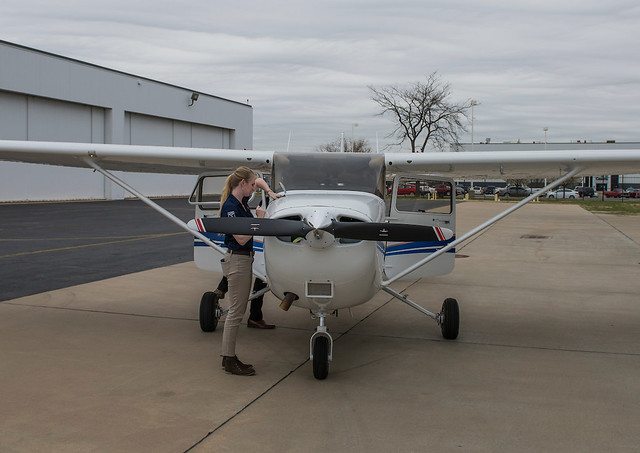 Ashley Tucker, a 2016 graduate, student preps a Cessna on the tarmac during her time at Auburn.