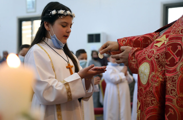 Christian children attend their First Communion ceremony at Mart Shmoni church in Erbil Kurdistan