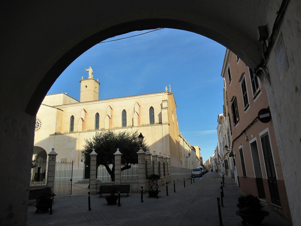 Monestir de Santa Clara framed by Sant Climent arch, Ciutadella, Menorca, Spain