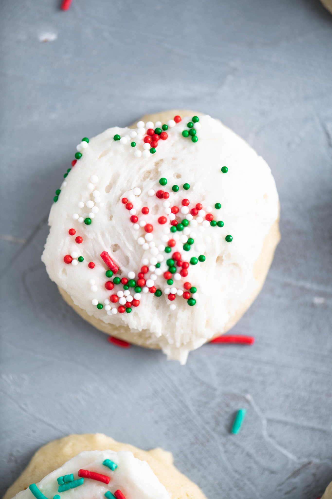These Italian Christmas cookies are the most tender, fluffy cookie around. With a cake-like texture and a not too sweet buttercream frosting, these are the perfect Christmas cookie. 