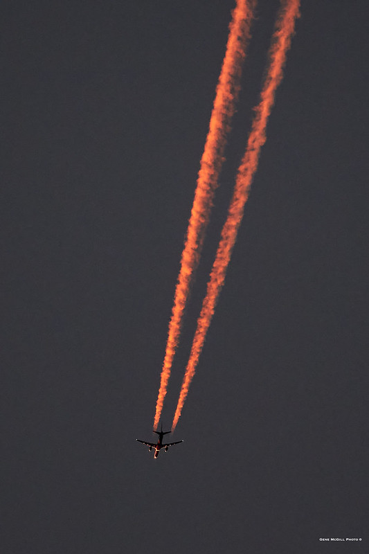Boeing 757 flying toward the sunrise