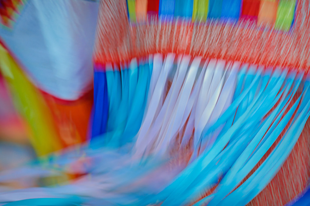 Slow shutter speed creating motion on a colorful regalia at the Arlee Powwow, Arlee, Montana