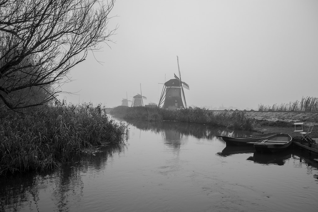 The Three Windmills in Fog