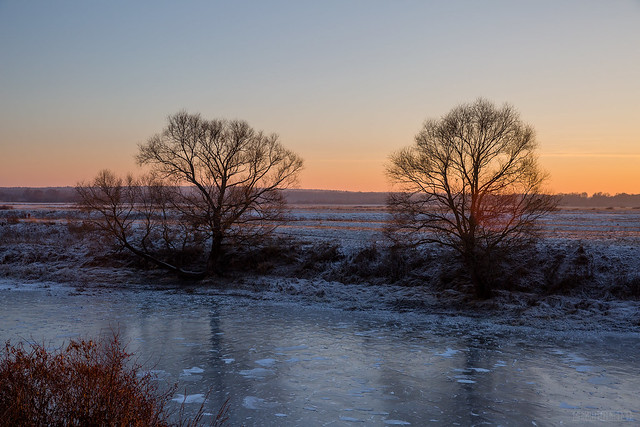 frozen river at sunset
