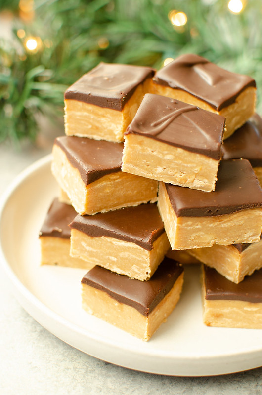 Buckeye Fudge - rich peanut butter fudge topped with a layer of chocolate ganache! It's like the buckeye candies in fudge form. Super easy recipe, made completely in the microwave!
