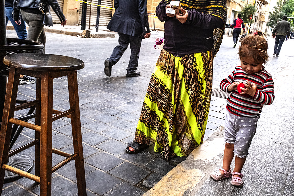 Mother selling two packets of tissues and her little girl who begs on 12-13-20--Beirut
