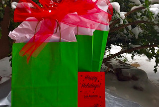 Holiday gift bags under a tree