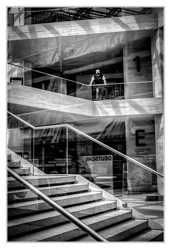 sdcfoto street streetphotography bw blackandwhite lonesome watchman guard man indoor architecture staircase reflection view people berlin museum concrete