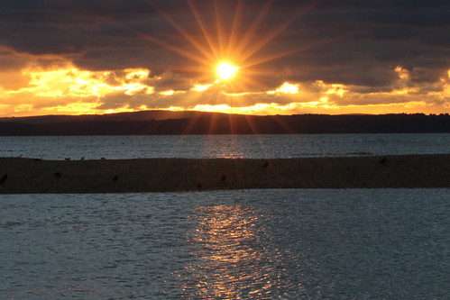 sunset starburst rays stokesbay gosport hampshire christmaseve