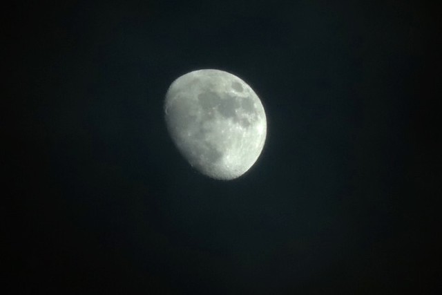 Christmas moon as the clouds race by December 25, 2020 Rochester, NY