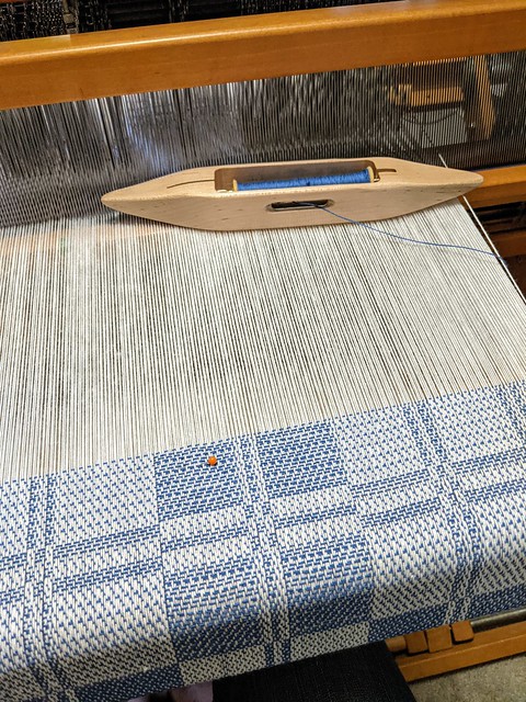 Weaving 2 block straight twill false damask pattern blue 8/2 cotton weft on white warp by irieknit on Schacht Mighty Wolf loom.
