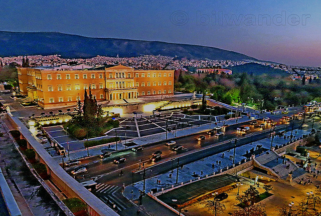 Greece.  Athens, Syntagma Square, parliament building view from Grand Bretagne hotel balcony at  early night