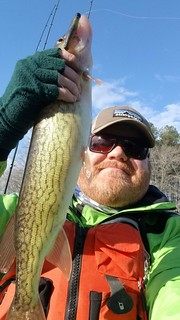 Photo of a man holding a pickerel