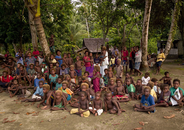 Spectators during the malagan tatuana masks dance, New Ireland Province, Langania, Papua New Guinea