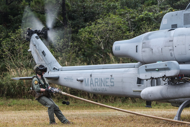 Marines refuel Viper attack helicopter during forward arming & refueling training in Okinawa, Japan