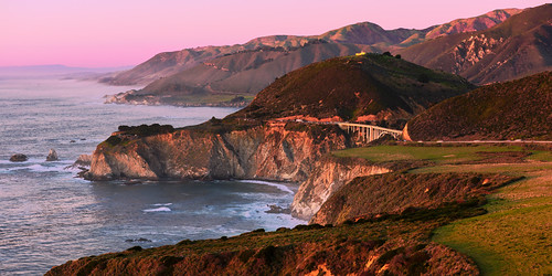 Sunset from Hurricane Point by jthight, The Bixby Bridge is an icon of the Big Sur Coast. The view of it from Hurricane Point is veiled, yet