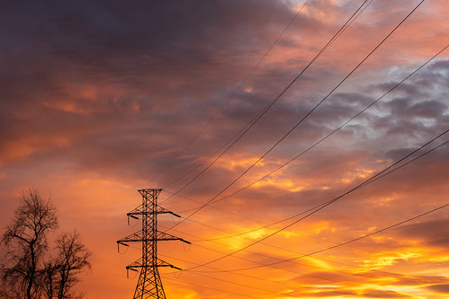 vintagelens canonfl 50mm f14 sunset sun color colorful winter clouds power powergrid powertower pylon electricity electricaltower electricgrid