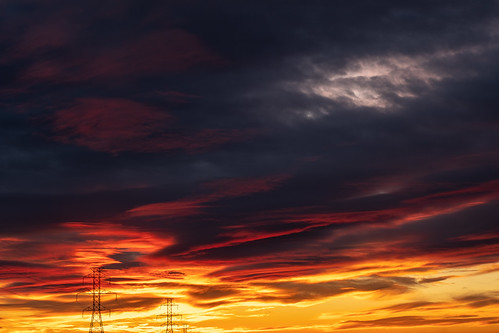 vintagelens canonfl 50mm f14 sunset sun color colorful winter clouds power powergrid powertower pylon electricity electricaltower electricgrid