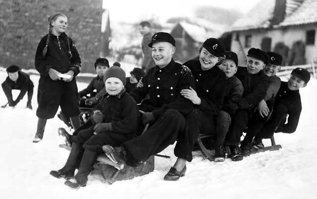 Having a fun day in the snow in Germany circa WW2