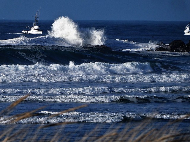 Crashing waves and a boat