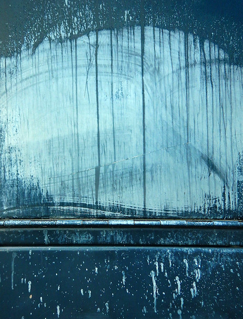 Paint drips and a metal hinge in Vancouver, Canada