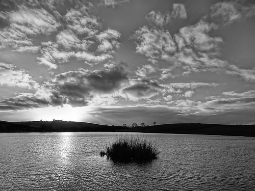 sunset on kernan with dark clouds in black and white