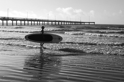 blackwhite early morning surfer surfing beach sand ocean sea gulf mexico waves sunrise coast blackandwhite monochrome port aransas texas pier travel fotocommunity lumix