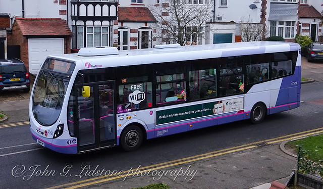 First Essex (Hadleigh) Wright StreetLite 47523, SN64 CMY with Christmas side vinyls, poppy and Covid reduced 17-seat capacity notice, as well as unusual larger front fleetnumber