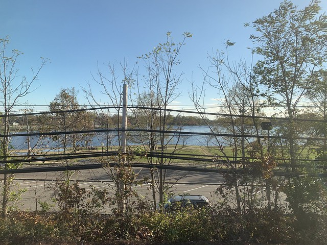 Long Island Rail Road LIRR to Penn Station NYC autumn foliage with reflecting lake on Long Island NY Halloween October 31st 2020