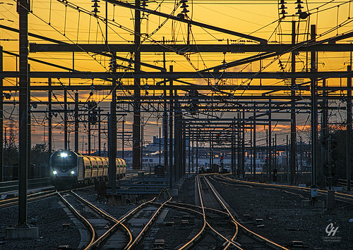 Regional at Sunset by Chris Henchey Photography, A northbound Amtrak Regional approaches Secaucus Junction station on the last couple of miles on the