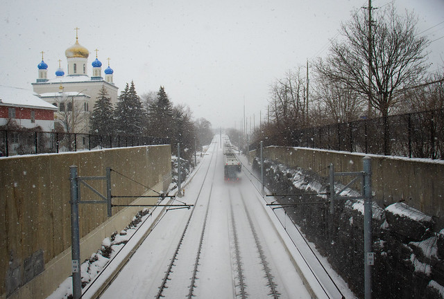 snowstorm with light rail train